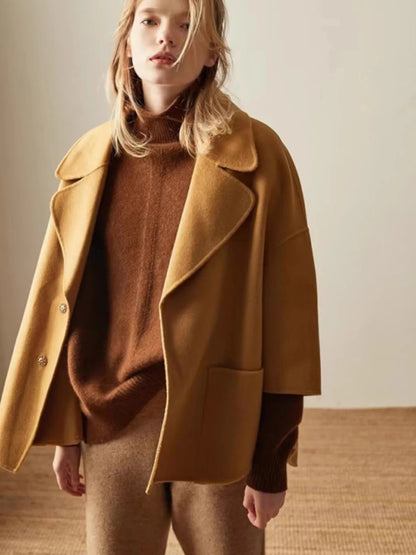 Women's Oversized Cashmere Turtleneck Knit Sweater – Close-up of camel cashmere knit and turtleneck collar detail