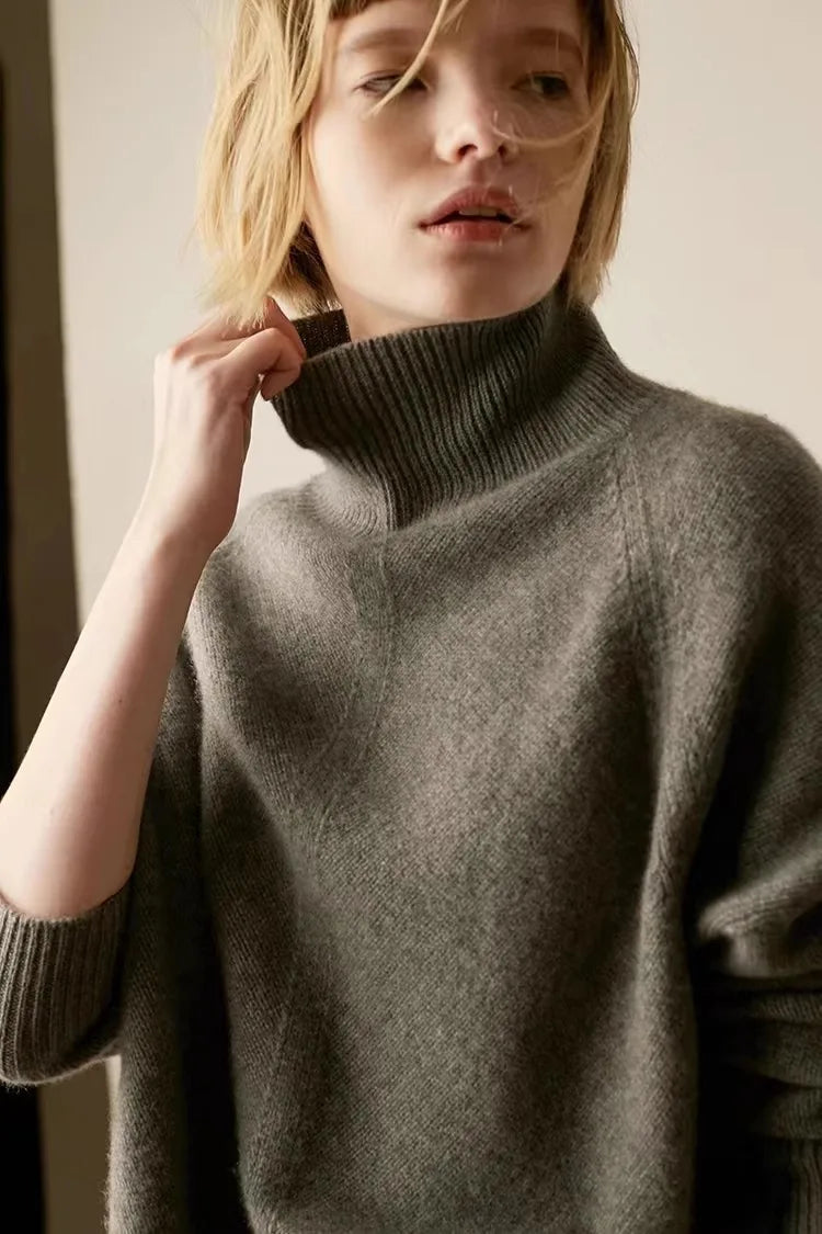 Women's Oversized Cashmere Turtleneck Knit Sweater – Full-length front view of gray cashmere turtleneck sweater on model